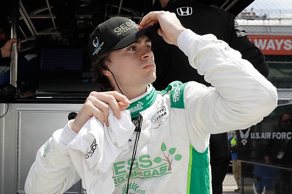 Colton Herta looks at his practice results during Tuesday's practice session for the Indianapolis 500 at Indianapolis Motor Speedway in Indianapolis.