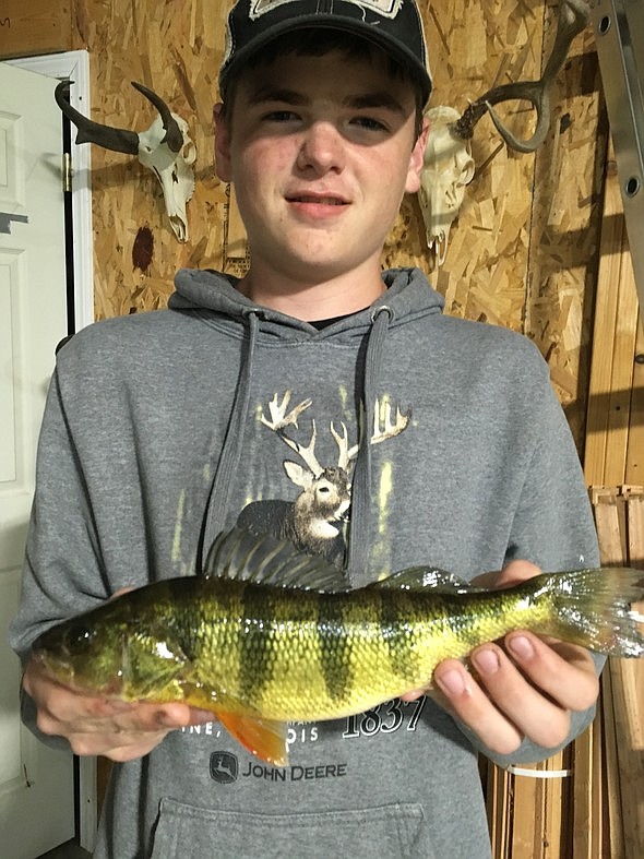 Isaac Bohm, 13, of Huntsville, caught Missouri's first state-record yellow perch taken by alternative methods May 11, 2019.
