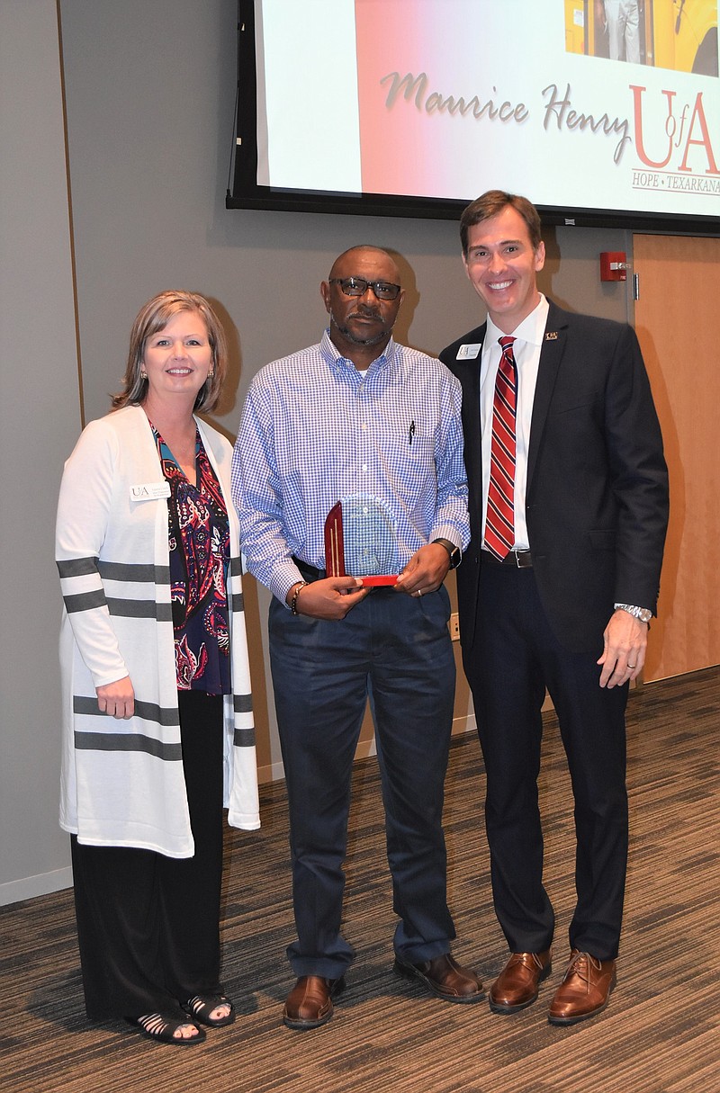 Maurice Henry of Fulton, Ark., was recently named as the University of Arkansas Hope-Texarkana 2019 Outstanding Alum. Shown are, from left, Laura Clark, UAHT vice chancellor for academics; Henry; and Chris Thomason, UAHT  chancellor. (Submitted photo)
