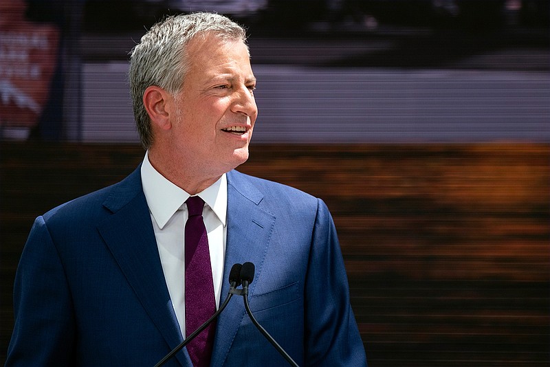 Democratic presidential candidate New York Mayor Bill de Blasio speaks during the official dedication ceremony of the Statue of Liberty Museum on Liberty Island Thursday, May 16, 2019, in New York.  (AP Photo/Craig Ruttle)
