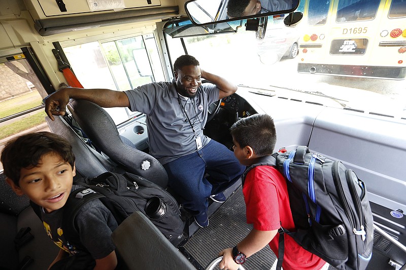 Richardson ISD school bus driver Curtis Jenkins  greeted students as they boarded after finishing school for the day at Lake Highlands Elementary School in Dallas on April 17, 2019. (Vernon Bryant/Dallas Morning News/TNS)