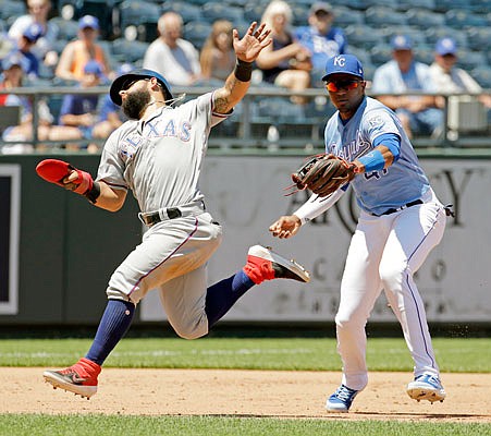 Rougned Odor of the Rangers is tagged out by Royals third baseman Kelvin Gutierrez during the fifth inning of Thursday afternoon's game at Kauffman Stadium.