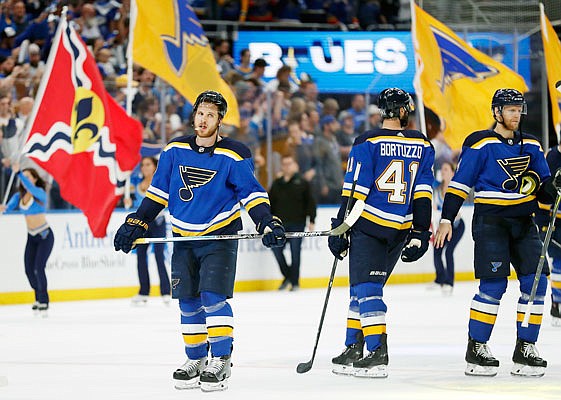 Blues players are cheered after Friday night's 2-1 win against the Sharks in Game 4 of the Western Conference finals in St. Louis.