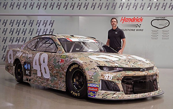 Jimmie Johnson stands next to his car for the Coca-Cola 600 earlier this week in Concord, N.C.
