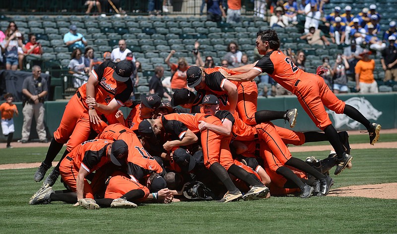 Nashville players celebrate after their 1-0 win over Shiloh Christian in the Class 4A state championship game Friday at Baum-Walker Stadium in Fayetteville. Scrapper pitcher Tristen Jamison was named Most Valuable Player. (NWA Democrat-Gazette photo by Andy Shupe)
