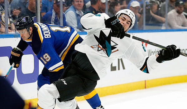 Timo Meier of the Sharks falls as he collides with Blues defenseman Jay Bouwmeester during the second period of Friday night's Game 4 of the Western Conference finals in St. Louis.