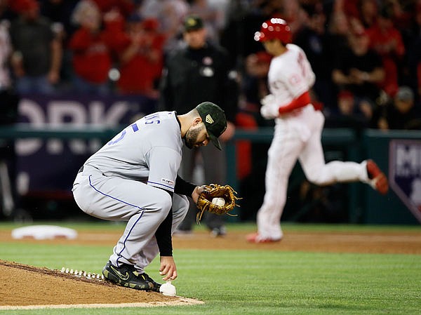 Royals starting pitcher Jakob Junis grabs the rosin bag as Shohei Ohtani of the Angels rounds third after hitting a two-run home run during the sixth inning of Saturday night's game in Anaheim, Calif.