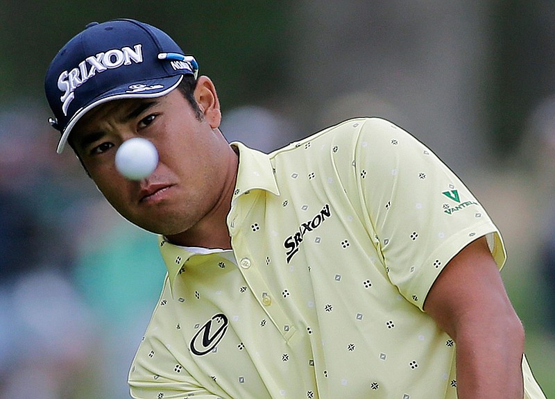  Hideki Matsuyama of Japan chips onto the 13th green during the final round of the PGA Championship on Sunday at Bethpage Black in Farmingdale, N.Y. 