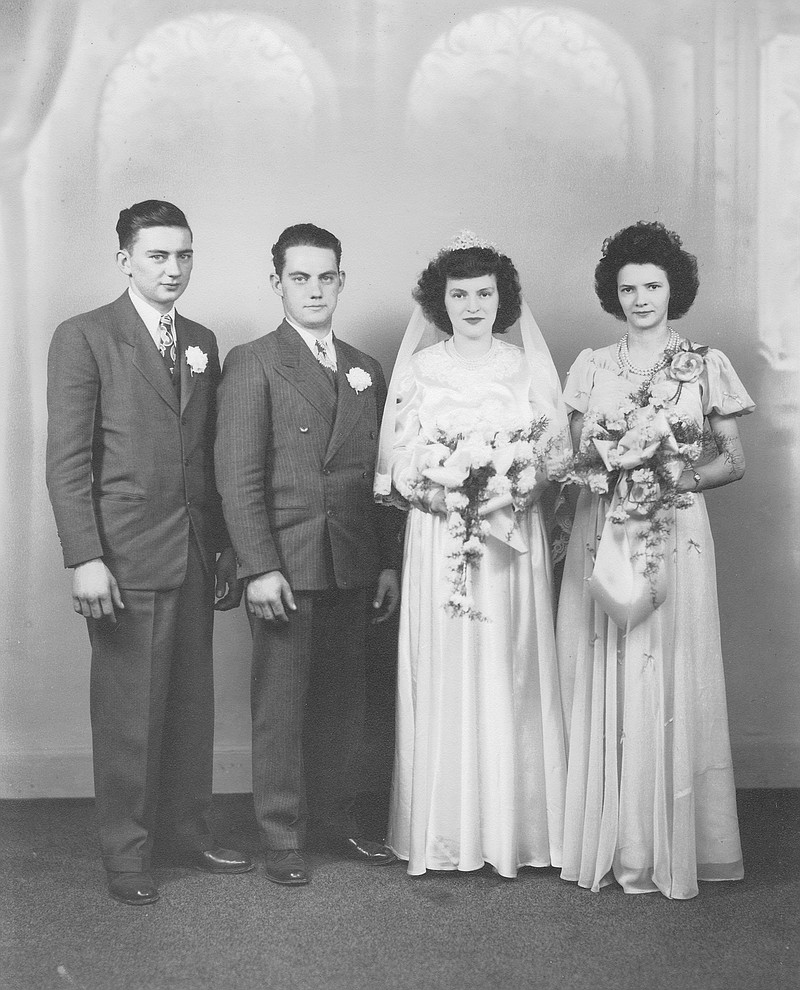 Louis Boehmer, second from left, is pictured next to his wife, Marie, in their wedding photograph from 1948. At far left is Boehmer's youngest brother, Andrew.