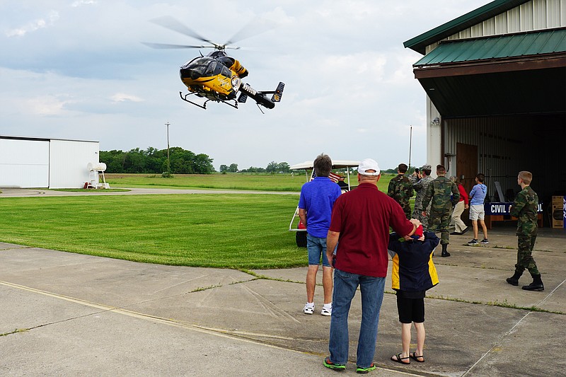 The crowd watches a helicopter arrive Saturday, May 18, 2019, during a Pancake Breakfast and Fly-In at the Elton Hensley Memorial Airport in Fulton. (Photo courtesy of John Swan)