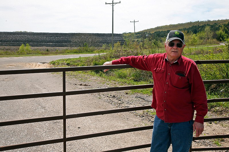 Tim Tanksley, who has been fighting for years trying to convince Oklahoma lawmakers to crack down on the coal ash dumping, stands outside a dump site on April 8, 2019, in Bokoshe, Okla. President Donald Trump's EPA has approved Oklahoma to be the first state to take over permitting and enforcement on coal-ash sites. "They're going to do absolutely nothing," Tanksley said. 