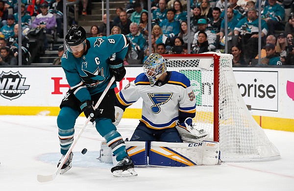 Blues goaltender Jordan Binnington makes a save against Joe Pavelski of the Sharks in the first period Sunday in Game 5 of the Western Conference finals in San Jose, Calif.