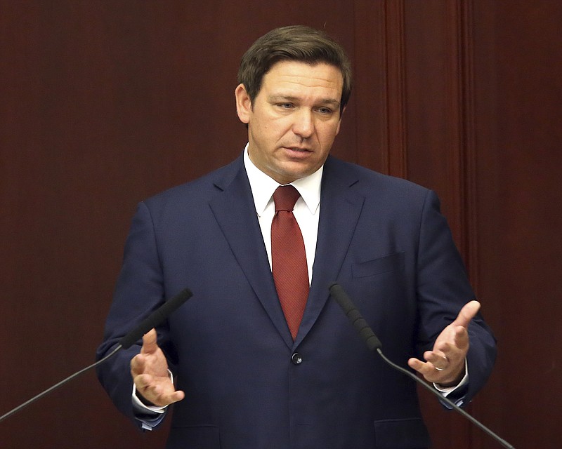 FILE- In this March 5, 2019 file photo. Florida Gov. Ron Desantis gives his state of the state address on the first day of legislative session, in Tallahassee, Fla. DeSantis is going to Israel with a large contingent of business leaders. That’s not surprising, especially as the GOP woos Jewish voters ahead of an important election year. But holding a meeting with the state's three independently elected Cabinet members while he's there has raised concerns about violating the state's open-meeting laws. (AP Photo/Steve Cannon, File)