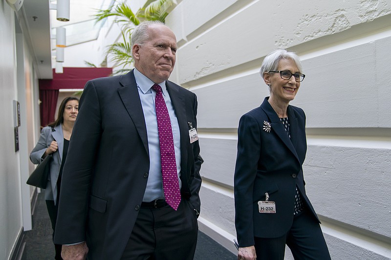 Former CIA Director John Brennan, left, and Wendy Sherman, right, a former State Department official and top negotiator of the Iran nuclear deal, arrive to meet with Speaker of the House Nancy Pelosi, D-Calif., about the situation in Iran, at the Capitol in Washington, Tuesday, May 21, 2019. (AP Photo/J. Scott Applewhite)