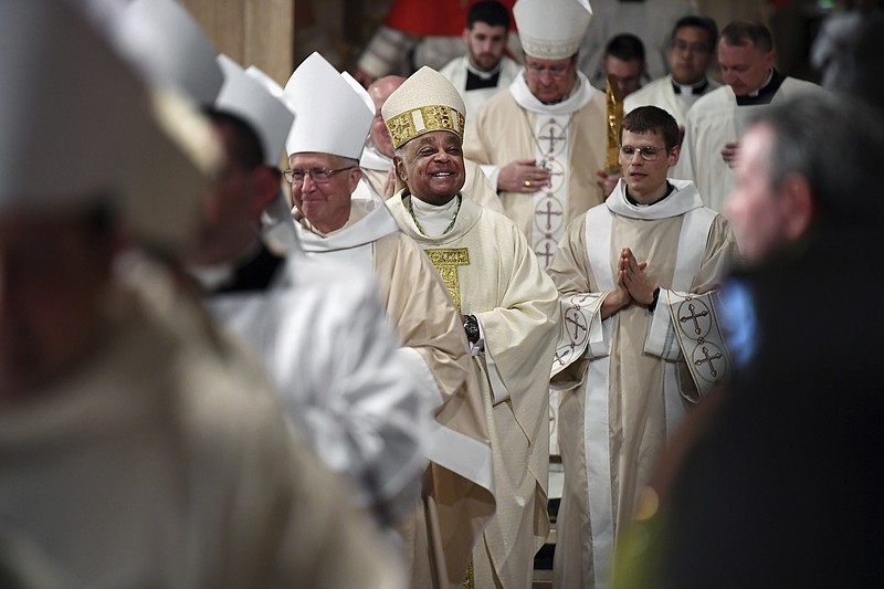 Archbishop Wilton Gregory, center, joins a procession during his installation as the seventh Archbishop of Washington at the Basilica of the National Shrine of the Immaculate Conception on Tuesday, May 21, 2019, in Washington. The Rev. Wilton D. Gregory was installed Tuesday as the seventh archbishop of Washington following a pair of high-profile sexual abuse cases that ensnared his two predecessors. (Matt McClain/The Washington Post via AP)