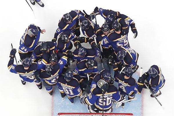 The Blues celebrate after beating the Sharks in Game 6 of the NHL Western Conference final Tuesday in St. Louis. The Blues won the game 5-1 to win the series 4-2.