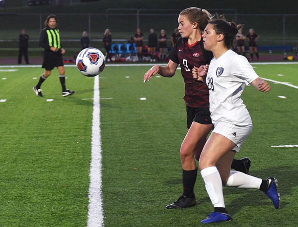 Lady Jays midfielder Bailey Dey battles Lee's Summit West defender Lakin Rold for possession of the ball during Tuesday's Class 4 sectional at Dwight T. Reed Stadium.