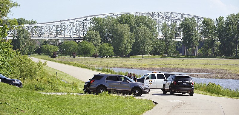 Jefferson City police converged onto Cottonwood Drive, the road to Noren Access, Wednesday afternoon, May 22, 2019, as they prepared to close the street in advance of rising floodwaters.