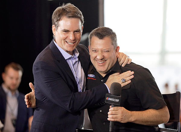 Tony Stewart (right) is congratulated by Jeff Gordon after being named to the NASCAR Hall of Fame class of 2020 during Wednesday's announcement in Charlotte, N.C.
