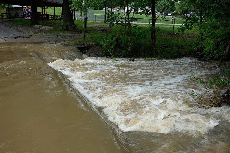 This flooding drainage creek, Smith Branch, separated Veterans Park into two segments this week, and by Thursday, was impassible. Fulton city officials have it barricaded and warn people not try to drive through flooded areas.