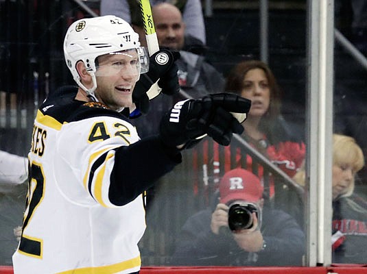 In this March 21 file photo, David Backes of the Bruins celebrates after scoring a goal during a game against the Islanders in Newark, N.J. Backes will face his former team Monday in Game 1 of the Stanley Cup Final when the Bruins host the Blues.