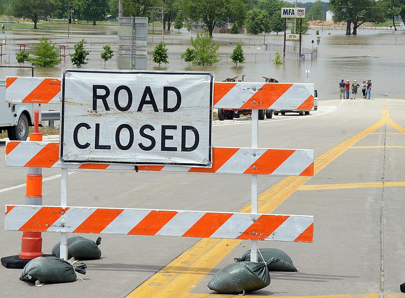 Onlookers watch as floodwaters from the Missouri River overtake the North Jefferson Recreation Area on Friday, May 24, 2019.