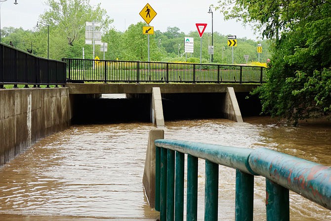 No one would dare try a tame stroll along Stinson Creek under Fulton's traffic circle this week. On Thursday morning, water levels in this and other drainage systems were high due to storms pounding the region this week.