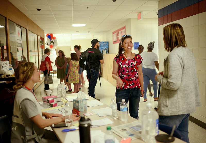 Sally Ince/ News Tribune
Mayor Carrie Tergin visits with Red Cross volunteers Friday May 24, 2019 inside the Red Cross shelter at Thomas Jefferson Middle School. Tergin visited to several locations around the city to speaks with volunteers helping residents affected by the tornado. 