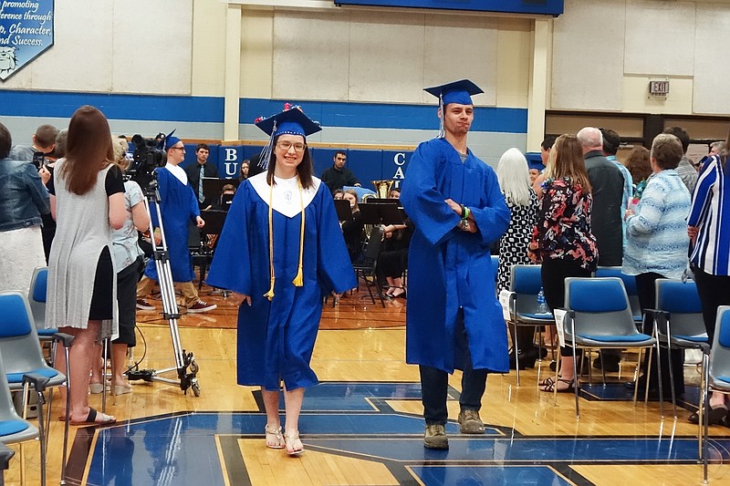 <p>Helen WIlbers/For the News Tribune</p><p>Salutatorian Jessica Buckner, left, and Kaleb Bullard strut into the South Callaway High School gym to the dulcet tones of ‘Pomp and Circumstance.’ The SCHS Class of 2019 graduated Friday evening.</p>