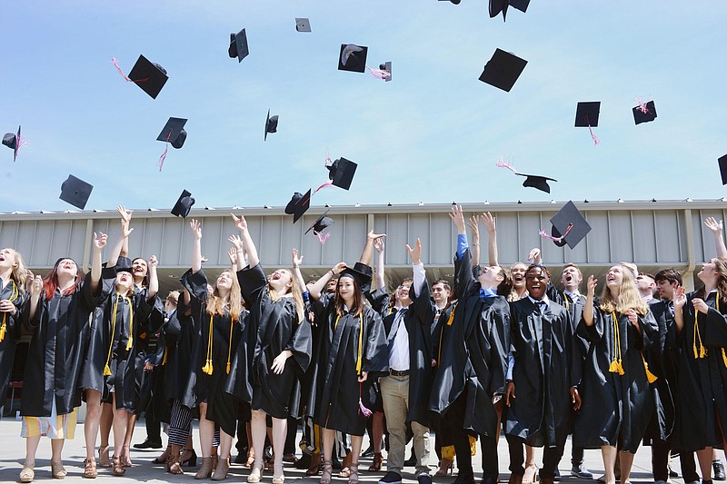 Sally Ince/ News Tribune
Students toss their caps after receiving their high school degree Saturday May 25, 2019 during the graduation ceremony at Calvary Lutheran High School.