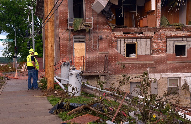 A utility crew from Ameren size up tornado damage on Lafayette Street near the Missouri State Penitentiary Saturday, May 25, 2019, following the May 22 storm in Jefferson City.