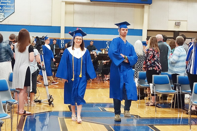 Salutatorian Jessica Buckner, left, and Kaleb Bullard strut into the South Callaway High School gym to the tune of "Pomp and Circumstance." The SCHS Class of 2019 graduated Friday evening.