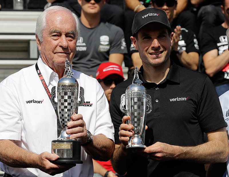 Car owner Roger Penske, left, and driver Will Power, of Australia, receive their "Baby Borg" trophies for winning last years race during the drivers meeting for the Indianapolis 500 IndyCar auto race at Indianapolis Motor Speedway, Saturday, May 25, 2019, in Indianapolis. (AP Photo/Darron Cummings)