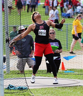 Devin Roberson of Jefferson City gets ready to release the discus during the Class 5 state track and field championships Saturday at Battle High School in Columbia. Roberson broke the Missouri all-class record during the competition with a throw of 218 feet, 4 inches.