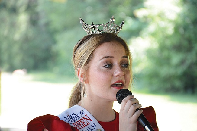 Allie Graves sings Sunday during a Memorial Day service at Memorial Gardens on US. Highway 67 North, east of Texarkana Regional Airport.