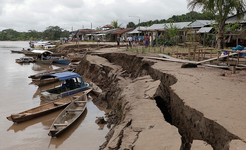 The banks of the Huallaga River are cracked after an earthquake in Puerto Santa Gema, on the outskirts of Yurimaguas, Peru, Sunday, May 26, 2019. A powerful magnitude 8.0 earthquake struck this remote part of the Amazon jungle in Peru early Sunday, collapsing buildings and knocking out power to some areas. (Guadalupe Pardo/Pool photo via AP)