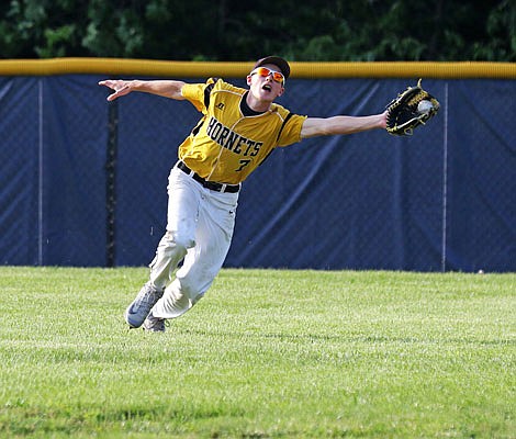 St. Elizabeth right fielder Kendal Bax makes a catch for the second out of the seventh inning of last Wednesday's Class 1 quarterfinal win against Wellsville in St. Elizabeth.