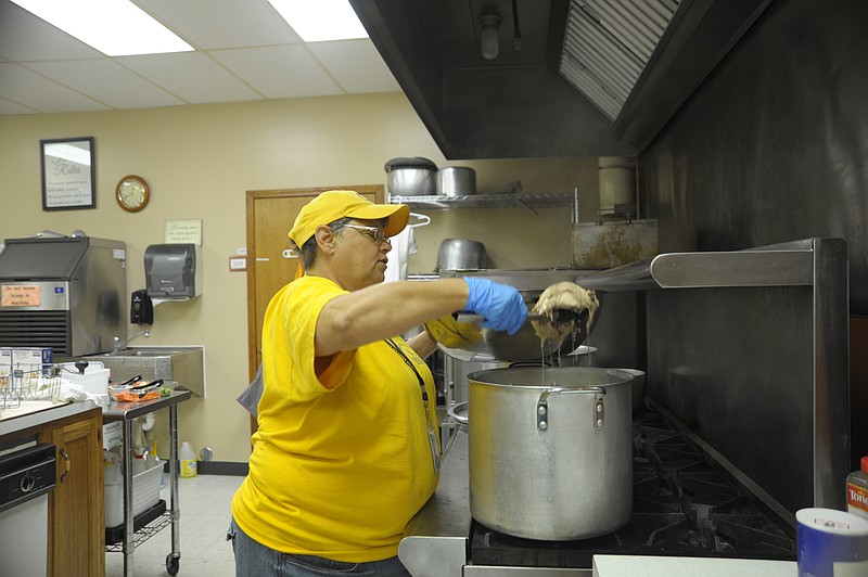 Patty Tuttle prepares dinner with Missouri Baptist Disaster Relief at Memorial Baptist Church in Jefferson City. Volunteering with her husband, Charles, they have worked group feeding for the community after the May 22, 2019, tornado.