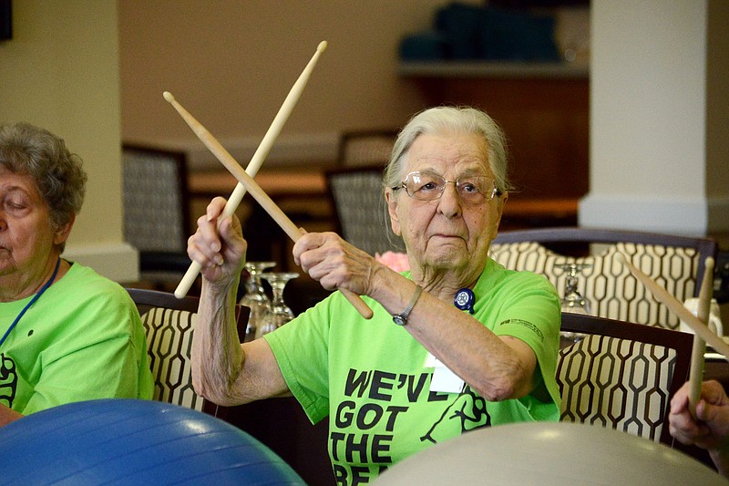 
Lucy Sjoblom creates music with her drum sticks Tuesday April 30, 2019 during the Drums Alive program at Heisinger Bluffs. The program encourages seniors to get moving by beating on large inflated balls with sticks and creating music to the beat. The program also works as a therapy activity for those with emotional, physical and mental strain. 