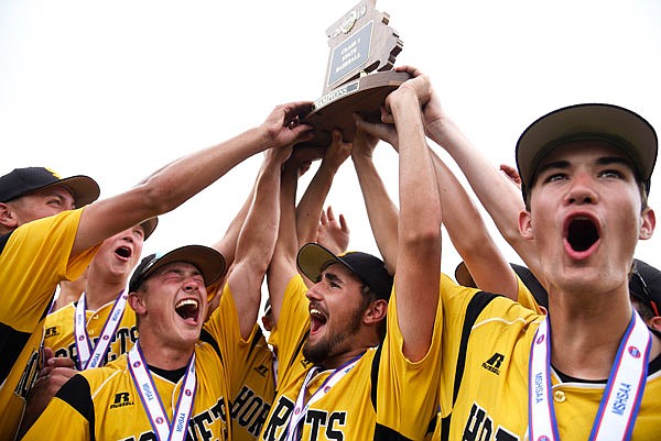 The St. Elizabeth baseball team lifts up the first-place trophy after defeating La Plata 2-1 in the Class 1 state championship game Wednesday afternoon at CarShield Field in O'Fallon.