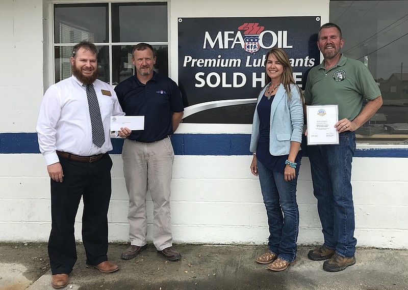 Pictured, from left, are Brandon Martin, WWU Advancement grant writer; Fred Trowbridge, of the MFA Oil Foundation; Jennie Petterson, WWU professor of Equine Studies, and Paul Schiltz, WWU associate professor and university veterinarian.