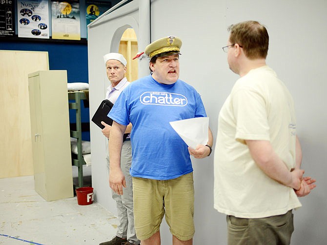 Terry Schoonover, playing Capt. Morton, scorns Will Runyon, playing Mister Roberts, Tuesday during a rehearsal at The Little Theater.
