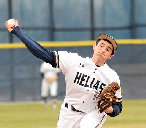 Kaleb Haley (13) of Helias throws a pitch during a game earlier this season against St. Louis University High at the American Legion Post 5 Sports Complex.