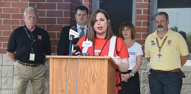 Representatives of several agencies were at Thomas Jefferson Middle School during a press conference Wednesday morning as Abigail Anderson, executive director of Central and Northern Missouri Chapter, Eastern Missouri Region of the American Red Cross, speaks about the Multi-Agency Resource Center that will be set up at The Linc today and Friday. From left are: Bill Farr of CEMA; Gabe Hulsey, board chair of Red Cross; Ann Bax, president of United Way of Central Missouri; and Jody Dickhaut with Adventist Community Services.