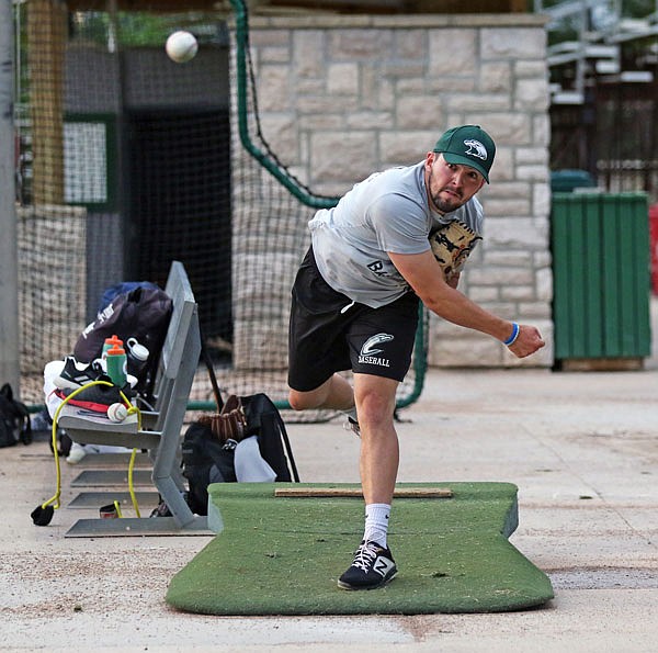 Tyler Robbins of the Jefferson City Renegades watches his pitch during Wednesday's practice at Vivion Field.