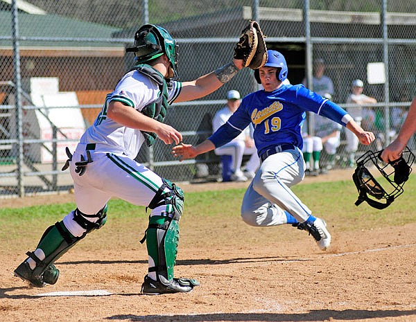 In this April 10, 2015, file photo, Fatima's Will Robertson slides into home plate as Blair Oaks catcher Dalton Fifer wheels around to apply the tag as Robertson tries beat the relay throw home in the Capital City Invitational. Robertson, a 2016 Fatima graduate, will play for Creighton in the NCAA Regionals today at Corvallis, Ore.