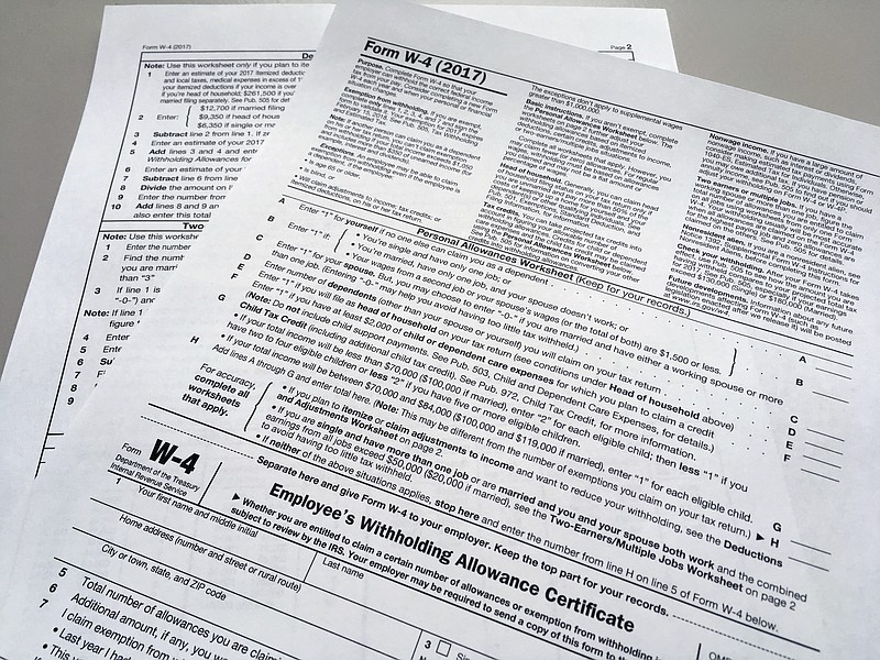 FILE - This Feb. 1, 2018 file photo shows an IRS W-4 form in New York. On Friday, May 31, 2019, the IRS is expected to release a proposed update to the form. Experts say that while it will be much more accurate, it will also be much more difficult. (AP Photo/Barbara Woike, File)