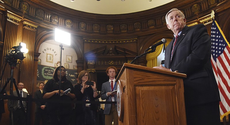 Gov. Mike Parson listens as a member of the media asks a question during a press conference in his Jefferson City, Mo., Capitol office Wednesday, May 29, 2019. (Julie Smith/The Jefferson City News-Tribune via AP)