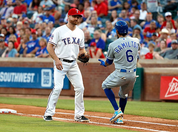 Rangers first baseman Logan Forsythe waits on the basepath to tag out Billy Hamilton of the Royals after Hamilton bunted in the fourth inning of Friday night's game in Arlington, Texas.