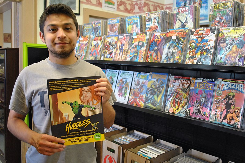 Kaden Quinn showcases a flyer for his recent Kickstarter campaign to print his first comic book, "Hurdles" May 31 at The Antiquarium Books & Collectibles in Jefferson City. Recently exceeding his $2,000 goal, Quinn plans to publish "Hurdles" this summer, with The Antiquarium being one location to purchase it.